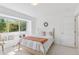 Bright bedroom with a cozy bed, large window, and a wreath on the wall, creating a warm atmosphere at 6128 Songbird Cir, Boulder, CO 80303