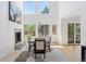 Elegant dining room with fireplace, hardwood flooring, large windows and high ceilings at 6128 Songbird Cir, Boulder, CO 80303