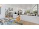 Open-concept kitchen features stainless appliances, a breakfast bar, and leads to the dining area at 6128 Songbird Cir, Boulder, CO 80303