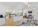Open floor plan with a modern kitchen flowing into the living room with fireplace at 6128 Songbird Cir, Boulder, CO 80303