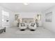 Spacious main bedroom showcasing a sitting area, plush carpeting and neutral tones at 6128 Songbird Cir, Boulder, CO 80303