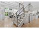 Modern staircase with metal railings, leading to the second level, bathed in natural light at 6128 Songbird Cir, Boulder, CO 80303