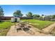 Outdoor seating, green grass, fence and shed at 5112 Duluth Ct, Denver, CO 80239