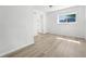 This bedroom features neutral walls, wood-look floors and a window at 5112 Duluth Ct, Denver, CO 80239