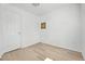 Cozy bedroom with hardwood floors, a closet door, and a neutral paint, offering a comfortable retreat at 5112 Duluth Ct, Denver, CO 80239