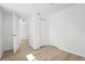This bedroom features neutral walls, wood-look floors, and a closet at 5112 Duluth Ct, Denver, CO 80239
