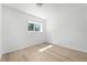 Simple bedroom design with hardwood floors, neutral paint, and natural light at 5112 Duluth Ct, Denver, CO 80239