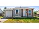 Charming single-story home features brick and siding, attached garage, and a well-maintained front yard at 5112 Duluth Ct, Denver, CO 80239