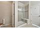 Modern bathroom features a tiled shower with a glass door and a built-in bench at 12201 Village Cir, Brighton, CO 80603