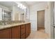Primary bathroom features tiled floors, granite counters and dual sinks, plus a tiled shower at 12201 Village Cir, Brighton, CO 80603