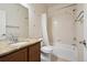 Bathroom featuring a granite vanity top, modern fixtures, and a tiled tub and shower at 12201 Village Cir, Brighton, CO 80603