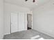 Bedroom with carpet, ceiling fan and closet with sliding doors at 12201 Village Cir, Brighton, CO 80603