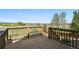Relaxing wooden deck with scenic views of greenery and mountain range at 12201 Village Cir, Brighton, CO 80603