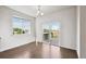 Dining area featuring hardwood floors and a sliding glass door to the deck at 12201 Village Cir, Brighton, CO 80603