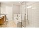 Modern bathroom with a soaking tub and a walk-in shower at 21621 Stoll Pl, Denver, CO 80249