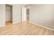 Bright bedroom with closet and laminate flooring at 21621 Stoll Pl, Denver, CO 80249