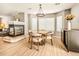 Bright dining area with a round table and hardwood floors at 21621 Stoll Pl, Denver, CO 80249