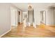 Upstairs hallway with light walls and laminate floors at 21621 Stoll Pl, Denver, CO 80249