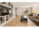 Living room showcasing built-in shelving and hardwood floors at 21621 Stoll Pl, Denver, CO 80249