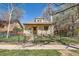 Attractive home featuring a fenced front yard and a covered front porch at 2314 Dexter St, Denver, CO 80207