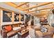Inviting living room featuring exposed wood beams, a spiral staircase, and stylish decor in an open floor plan at 2314 Dexter St, Denver, CO 80207