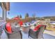 Deck with seating area and views of backyard landscaping at 77 N Irvington St, Aurora, CO 80018