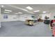 Spacious basement workshop with ample storage and workbenches at 77 N Irvington St, Aurora, CO 80018