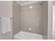 Clean bathroom with a shower/tub combo and neutral tile at 77 N Irvington St, Aurora, CO 80018