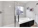 Bathroom with soaking tub and separate shower at 77 N Irvington St, Aurora, CO 80018