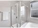 Bathroom with shower and tub, featuring white tile at 77 N Irvington St, Aurora, CO 80018