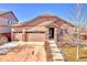 Ranch style home with two-car garage and landscaped yard at 77 N Irvington St, Aurora, CO 80018