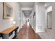 Long hallway with hardwood floors and access to other rooms at 77 N Irvington St, Aurora, CO 80018