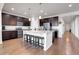 Kitchen features island with seating and hardwood floors at 77 N Irvington St, Aurora, CO 80018