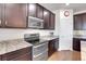 Kitchen with stainless steel appliances and ample cabinet space at 77 N Irvington St, Aurora, CO 80018