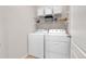 Laundry room with washer, dryer, and shelving at 77 N Irvington St, Aurora, CO 80018