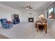 Living room featuring a fireplace and ample natural light at 77 N Irvington St, Aurora, CO 80018