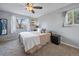 Cozy bedroom with natural light, soft carpeting, and a view of the outdoors at 13393 E Asbury Dr # 103, Aurora, CO 80014