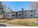Inviting multi-Gathering residence with charming balconies and stone chimney details, offering a cozy and welcoming atmosphere at 13393 E Asbury Dr # 103, Aurora, CO 80014