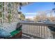 Relaxing outdoor patio with seating, landscaping, and views of the parking area at 13393 E Asbury Dr # 103, Aurora, CO 80014