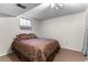 Comfortable bedroom features neutral carpet and good light at 8427 S Custer Ln, Evergreen, CO 80439