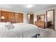 Large bedroom featuring plush carpet, closet, with adjoined bathroom vanity at 8427 S Custer Ln, Evergreen, CO 80439