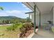 Covered front porch showcasing mountain views and charming architectural details at 8427 S Custer Ln, Evergreen, CO 80439