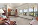 Bright living room with scenic views from the large windows and comfortable seating at 8427 S Custer Ln, Evergreen, CO 80439