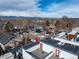 Rooftop deck boasts city views, and neighborhood surroundings on a sunny day at 4551 Tennyson St, Denver, CO 80212