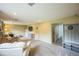 Spacious carpeted basement featuring a seating area and ample natural light at 8935 W Swarthmore Dr, Littleton, CO 80123