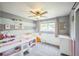 Cozy bedroom features a bunk bed with storage, carpeted floors, and a ceiling fan at 8935 W Swarthmore Dr, Littleton, CO 80123