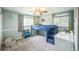 Bright bedroom features a loft bed, carpeted floors, and large windows at 8935 W Swarthmore Dr, Littleton, CO 80123