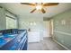 Bright bedroom features a loft bed, carpeted floors, and mint green walls at 8935 W Swarthmore Dr, Littleton, CO 80123