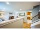 Cozy living space featuring an open layout and easy access to the kitchen and stairs at 8935 W Swarthmore Dr, Littleton, CO 80123