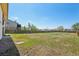 Expansive backyard with a wooden fence offering privacy and a large open space for outdoor activities at 831 Sable Blvd, Aurora, CO 80011